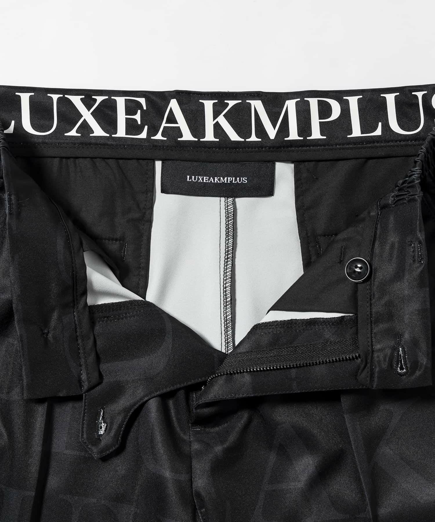 LUXEAKMPLUS(リュクスエイケイエムプラス)ゴルフ 総柄ロゴハーフ
