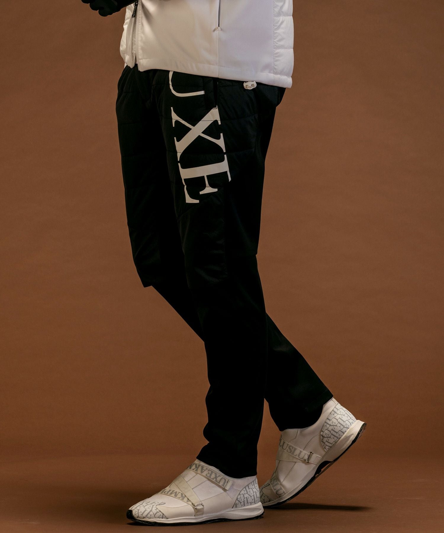 KITH ナイロンパンツ ブラック L 美品 LUXEAKMPLUS(リュクスエイケイエムプラス)ゴルフ 軽量ナイロンロング